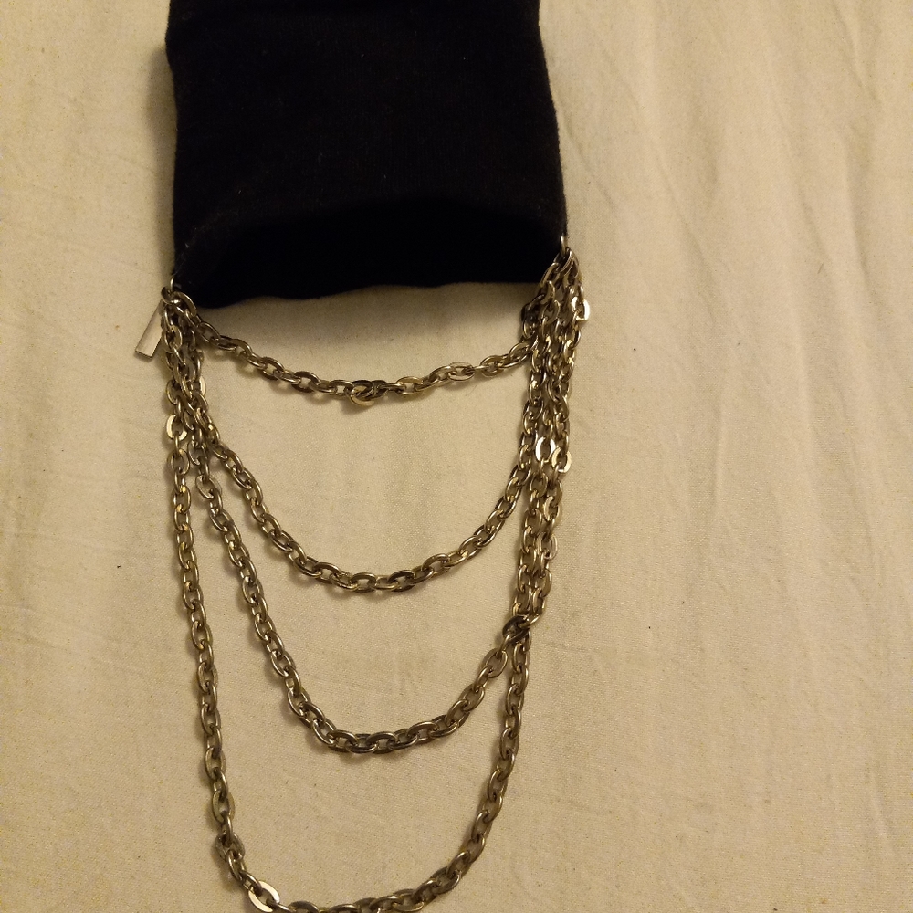Black cotton material with silver layer chains